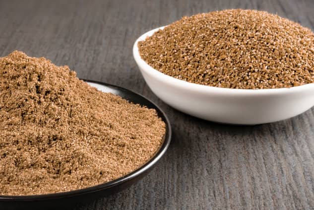 Ground and curshed caraway on bowls on a table